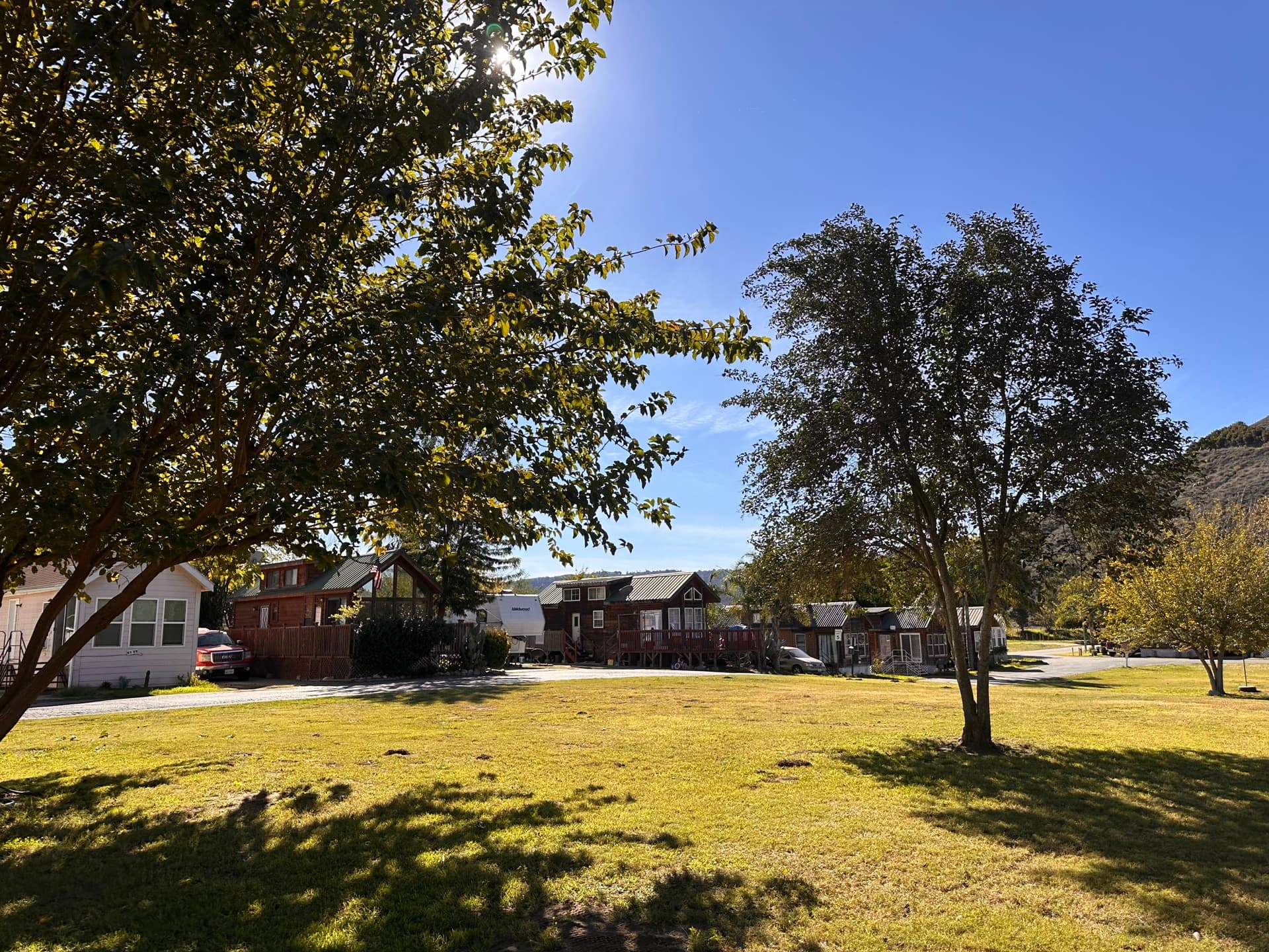 Community cabins and green lawn at Rancho Corrido Park
